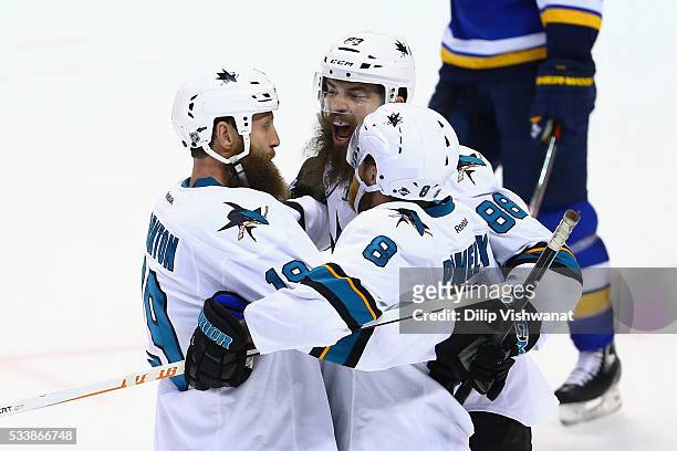 Joe Pavelski of the San Jose Sharks celebrates with Joe Thornton and Brent Burns after scoring a second period goal against the St. Louis Blues in...