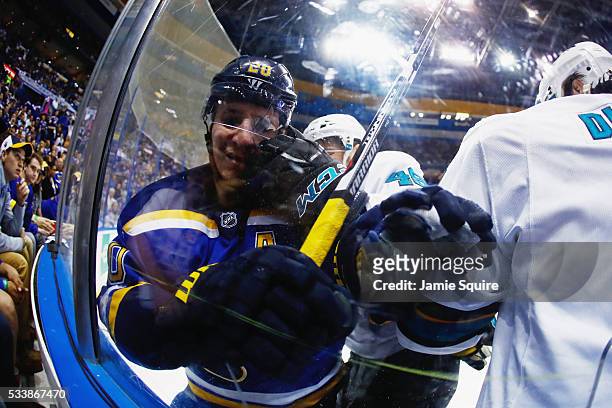 Alexander Steen of the St. Louis Blues and Tomas Hertl of the San Jose Sharks battle against the glass during the second period in Game Five of the...