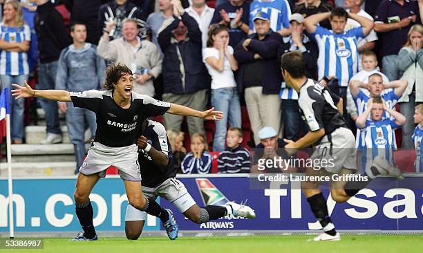Hernan Crespo of Chelsea is mobbed after scoring the last minute winner, during the Barclays Premiership match between Wigan Athletic and Chelsea on...