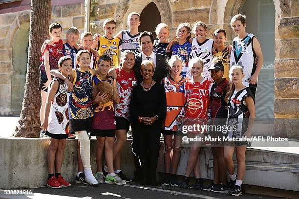 Aunty Pam Pedersen, AFL CEO Gillon McLachlan and children wearing Indigenous Round Jerseys pose during the 2016 Toyota AFL Sir Doug Nicholls...