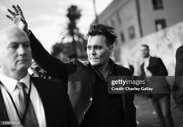 Actor Johnny Depp attends Disneys 'Alice Through the Looking Glass' premiere with the cast of the film, which included Johnny Depp, Anne Hathaway,...