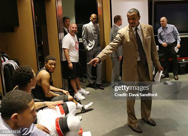 Toronto Raptors Head Coach Dwane Casey speaks to Kyle Lowry of the Toronto Raptors and DeMar DeRozan of the Toronto Raptors after defeating the...