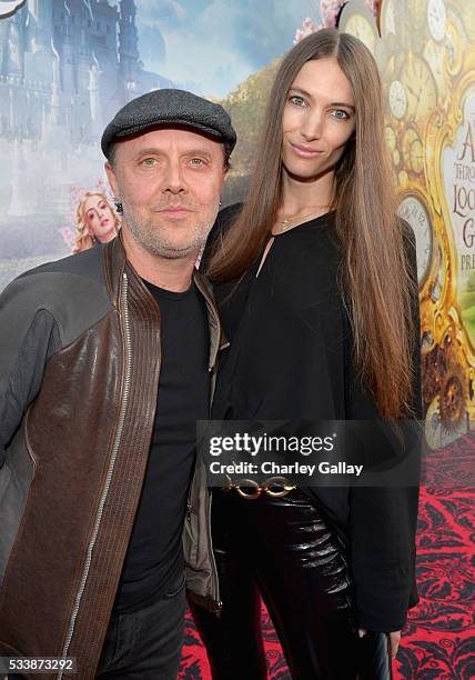 Drummer Lars Ulrich and model Jessica Miller attend Disneys 'Alice Through the Looking Glass' premiere with the cast of the film, which included...