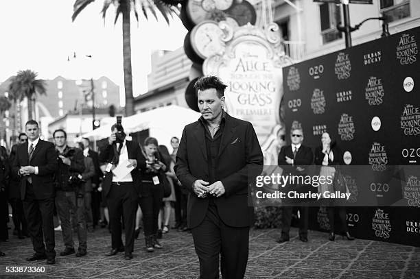 Actor Johnny Depp attends Disneys 'Alice Through the Looking Glass' premiere with the cast of the film, which included Johnny Depp, Anne Hathaway,...