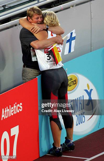 Christina Obergfoll of Germany embraces her coach Werner Daniels after she came second in the women's Javelin Throw final at the 10th IAAF World...