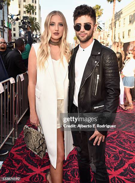 Actress Veronica Dunne and actor Max Ehrich attend Disneys 'Alice Through the Looking Glass' premiere with the cast of the film, which included...