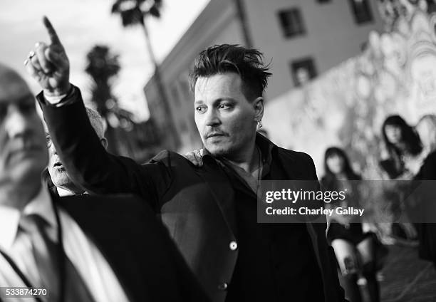 Actor Johnny Depp attends Disneys 'Alice Through the Looking Glass' premiere with the cast of the film, which included Johnny Depp, Anne Hathaway,...