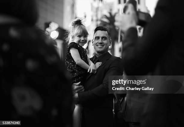 Motorcycle racer Carey Hart and Willow Sage Hart attend Disneys 'Alice Through the Looking Glass' premiere with the cast of the film, which included...