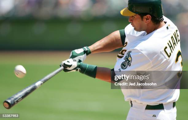 Eric Chavez of the Oakland Athletics makes contact with the ball against the Minnesota Twins during an MLB game on August 14, 2005 at McAfee Coliseum...