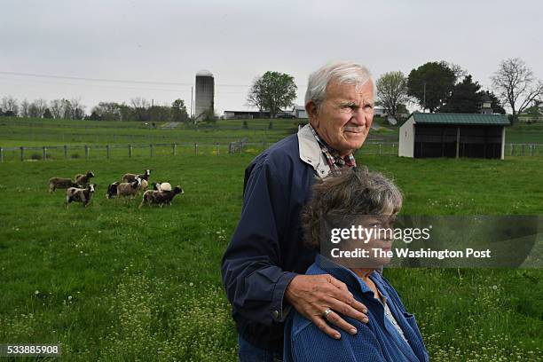 Fred Horak and his wife, Joan Horak pose for a portrait along with some of their Jacob sheep on their property on Wednesday May 11, 2016 in...