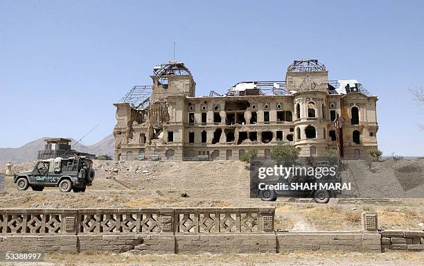 Hungarian soldiers of the International Security Assistance Force patrol near the war damaged Darlaman palace in Kabul, 15 August 2005. Security has...