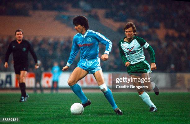 Joachim Loew of Karlsruhe and Benno Moehlmann of Bremen fight for a ball during the Bundesliga match SV Werder Bremen against Karlsruher SC at the...