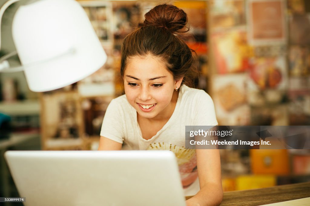 Girl doing research on laptop