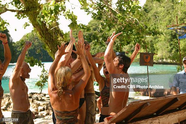 Castaways during the second episode of Survivor: Palau, during the immunity challenge, "Heads Up", the Koror Tribe, celebrates victory, Janu Tornell,...