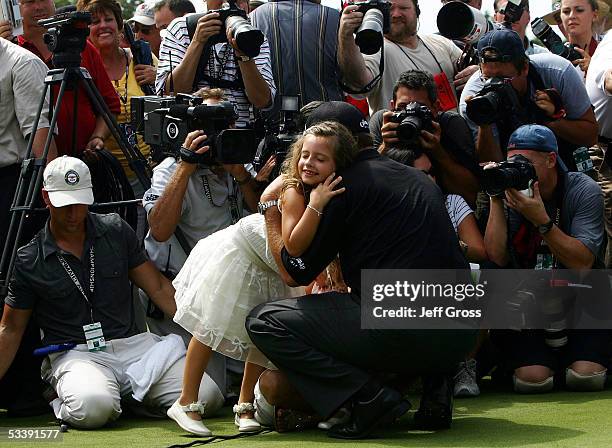 Amanda Mickelson hugs her father, Phil Mickelson in front of a mass of photographers after Phil won the 2005 PGA Championship on August 15, 2005 in...