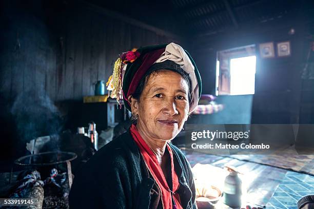 portrait of old asian woman inside her house - myanmar culture stockfoto's en -beelden