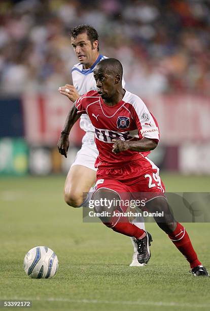 Thiago of the Chicago Fire plays the ball against Chris Klein of the Kansas City Wizards during their MLS match on August 10, 2005 at Soldier Field...