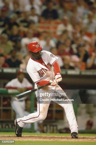 Preston Wilson of the Washington Nationals takes a swing in a game against the Colorado Rockies on July 19, 2005 at RFK Stadium in Washington D.C....