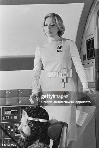 American actress Barbara Bain and English actor John Standing pictured together in character as Doctor Helena Russell and Pasc on set during filming...