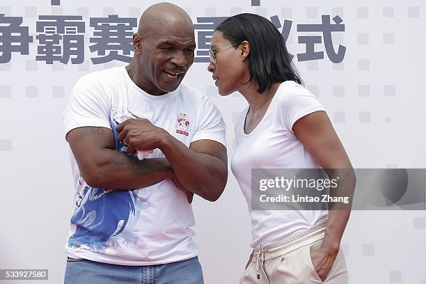 Former Heavy Weight Champion Boxer Mike Tyson talk with Cecilia Braekhus of Norway during the Great Wall Weigh-in of IBF World Boxing Championship...