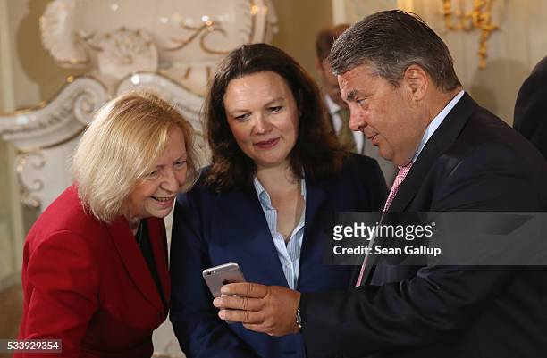 German Vice Chancellor and Economy and Energy Minister Sigmar Gabriel shows Education Minister Johanna Wanka and Minister of Work and Social Issues...