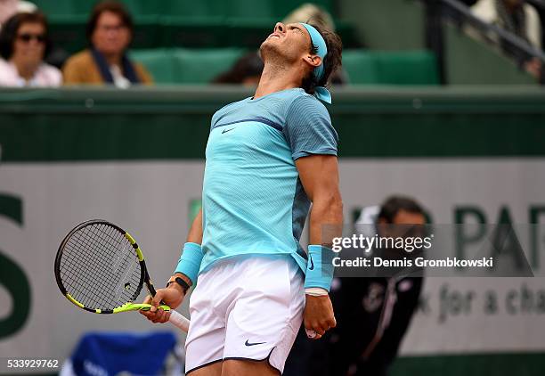 Rafael Nadal of Spain reacts during the Men's Singles first round match against Sam Groth of Australia on day three of the 2016 French Open at Roland...