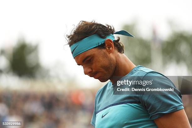 Rafael Nadal of Spain reacts during the Men's Singles first round match against Sam Groth of Australia on day three of the 2016 French Open at Roland...