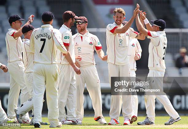 Tom Bailey of Lancashire celebrates taking the wicket of Arun Harinath of Surrey during the Specsavers County Championship Division One match between...