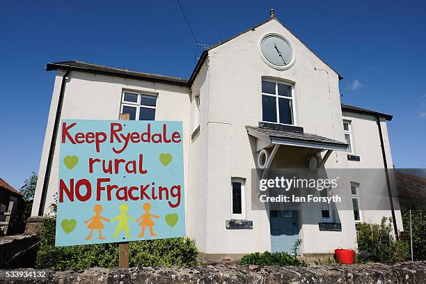 An anti fracking sign is displayed in the garden of a home on the outskirts to the village of Kirby Misperton on May 24, 2016 in Malton, England....