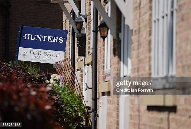 For sale sign can be seen outside a home in the village of Kirby Misperton on May 24, 2016 in Malton, England. North Yorkshire Planning and...