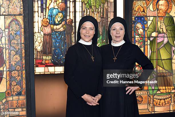 Actress Janina Hartwig and Nina Hoger during a photocall for the tv show 'Um Himmels Willen' at Literaturhaus on May 24, 2016 in Munich, Germany.