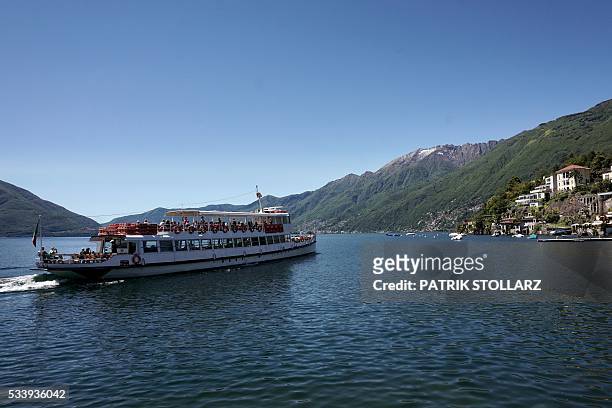 Tourist boat sails from the town of Ascona on Lago Maggiore also called Lake Langen on May 24, 2016. The German national football team will train...