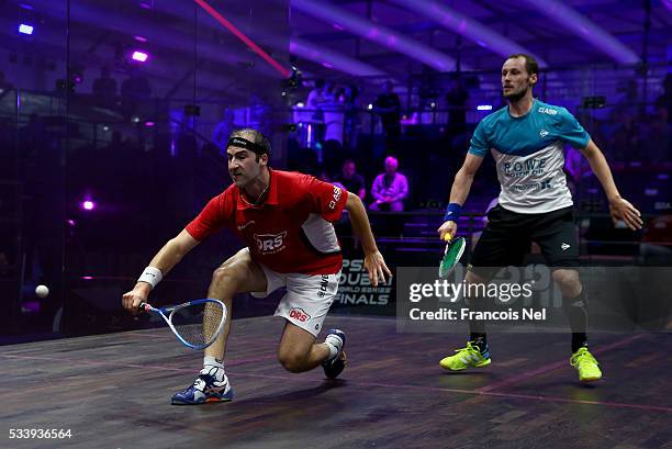 Simon Rosner of Germany competes against Gregory Gaultier of France during day one of the PSA Dubai World Series Finals 2016 at Burj Park on May 24,...