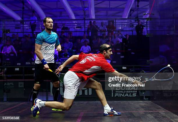 Simon Rosner of Germany competes against Gregory Gaultier of France during day one of the PSA Dubai World Series Finals 2016 at Burj Park on May 24,...