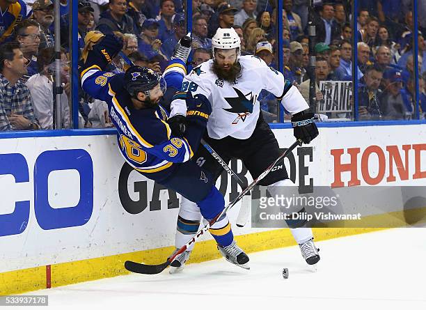 Brent Burns of the San Jose Sharks checks Troy Brouwer of the St. Louis Blues during the third period in Game Five of the Western Conference Final...