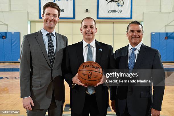 Orlando Magic general manager Rob Hennigan, head coach Frank Vogel and CEO Alex Martins pose for a portrait on May 23, 2016 at Amway Center in...