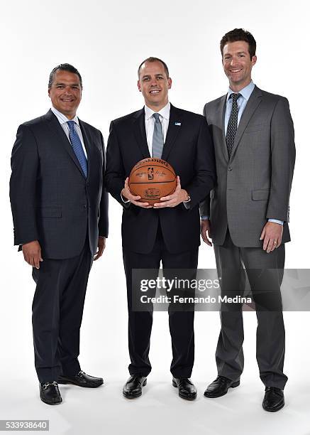 Orlando Magic general manager Rob Hennigan, head coach Frank Vogel and CEO Alex Martins pose for a portrait on May 23, 2016 at Amway Center in...