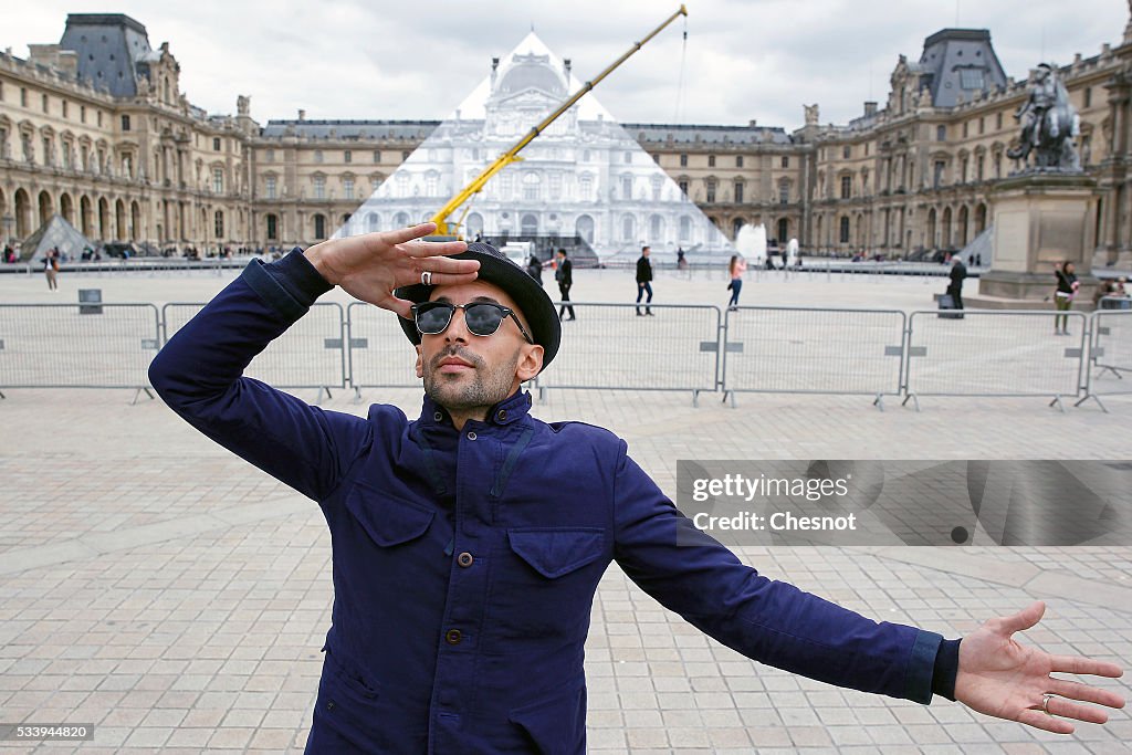 French Street Artist JR Installs A Public Artwork At The Louvre Museum In Paris
