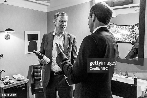 Episode 374 -- Pictured: Governor John Hickenlooper talks with host Seth Meyers backstage on May 23, 2016 --