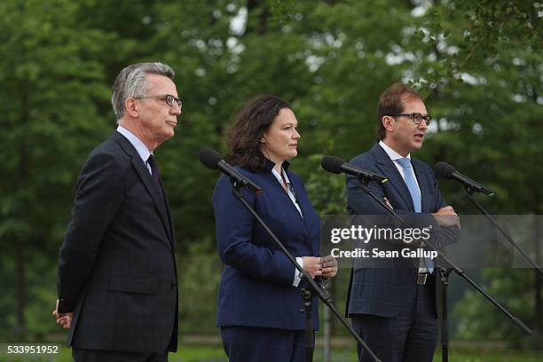 German Interior Minister Thomas de Maiziere , Minister of Work and Social Issues Andrea Nahles and Transport and Digital Technologies Minister...