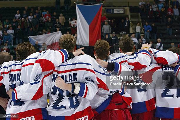 Members of Team Czech Republic celebrate their win over Team USA during the bronze medal game at the World Jr. Hockey tournament at the Ralph...