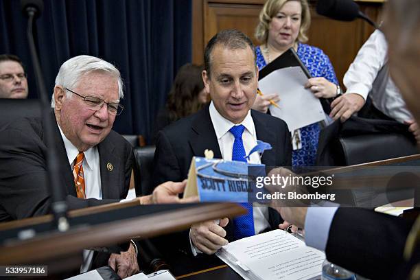 Representative Scott Rigell, a Republican from Virginia, right, shows Representative Harold "Hal" Rogers, a Republican from Kentucky and chairman of...