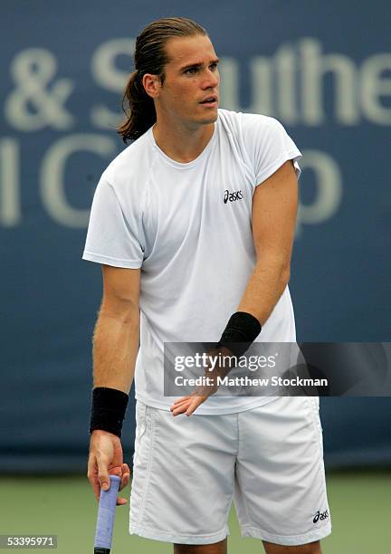 Tommy Haas of Germany disputes a call while playing Paul-Henri Mathieu of France during the Western & Southern Financial Group Masters on August 16,...