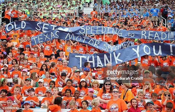 Students of Old Settlers Elementary cheer during the Speeding To Read Championship Assembly at Texas Motor Speedway on May 24, 2016 in Fort Worth,...