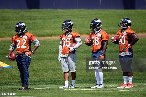 Denver Broncos running backs C.J. Anderson Kapri Bibbs Cyrus Gray and Juwan Thompson look on during OTA's May 24, 2016 at UCHealth Training Facility.