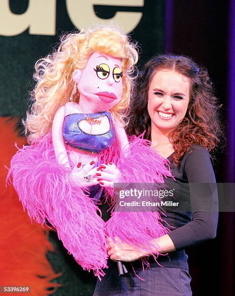 Actress Brynn O'Malley operates "Lucy the Slut" one of the puppet character's in the Broadway musical "Avenue Q," during a news conference to...
