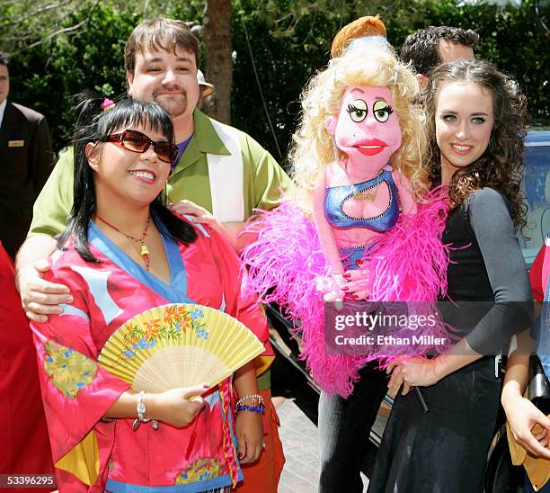 Actress Natalie Gray, actor Cole Porter and actress Brynn O'Malley, holding the "Lucy the Slut" puppet character from the Broadway musical "Avenue...