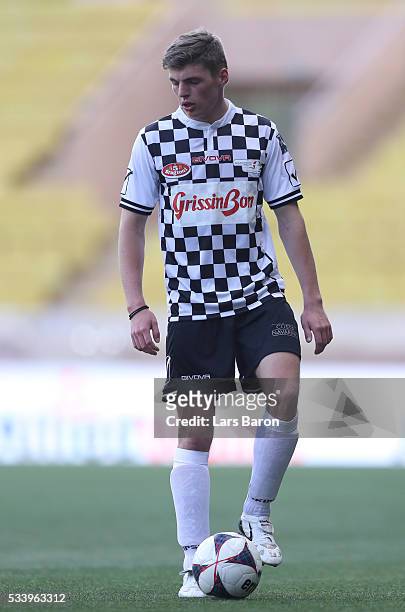 Max Verstappen of Netherlands and Red Bull Racing with the ball during the 24th World Stars football match at Stade Louis II, Monaco before the...