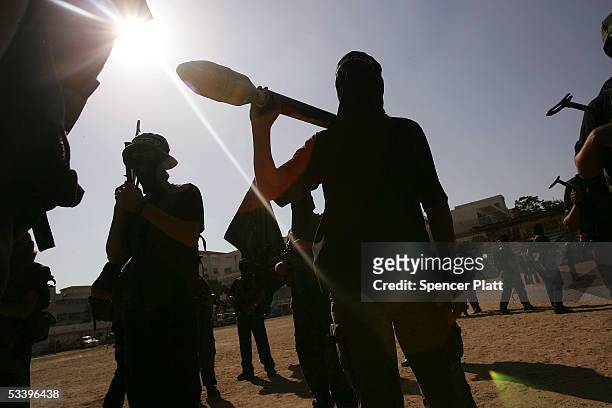 Members of the militant wing of Fatah participate in a rally August 16, 2005 in Gaza City, Gaza Strip. Israel closed off all entry into the...