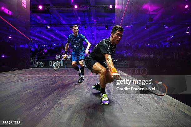 Miguel Angel Rodriguez of Colombia competes against Nick Matthew of England during day one of the PSA Dubai World Series Finals 2016 at Burj Park on...